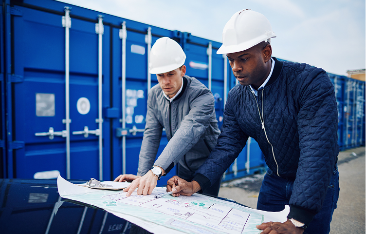 Two Male Colleagues Office Standing With Laptop 1